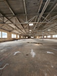 An empty warehouse with a lot of windows