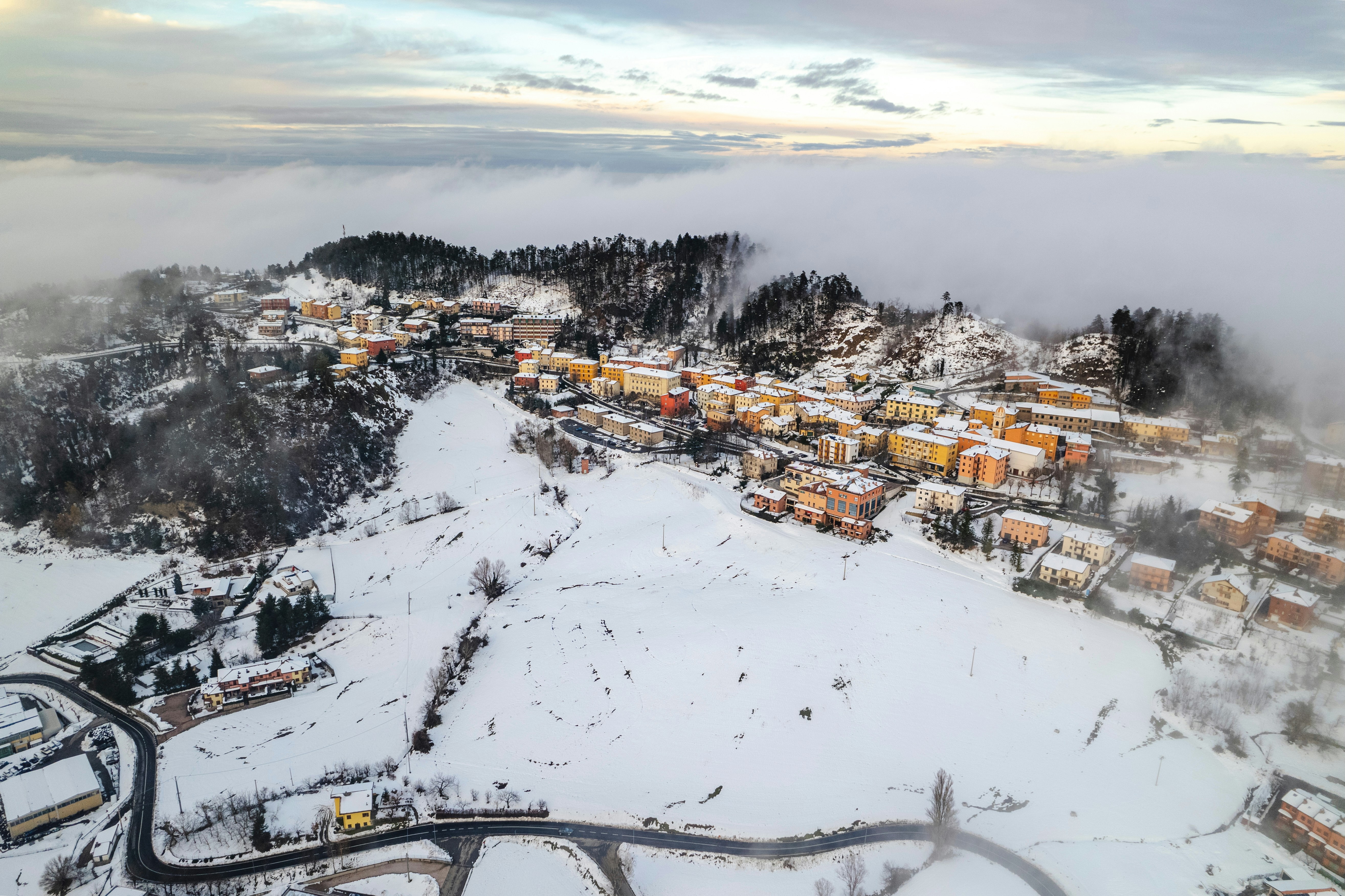 An aerial view of a town in the snow