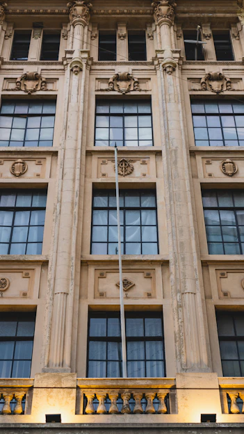 A tall building with a flag on top of it