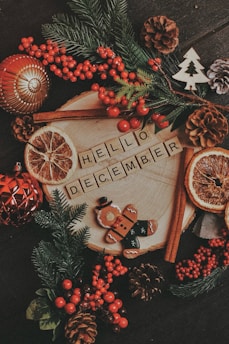 A table topped with oranges and pine cones
