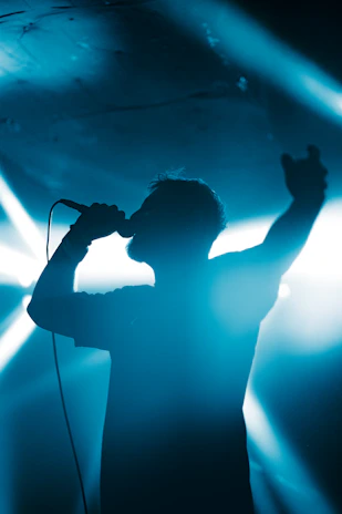 A man standing on a stage with a microphone