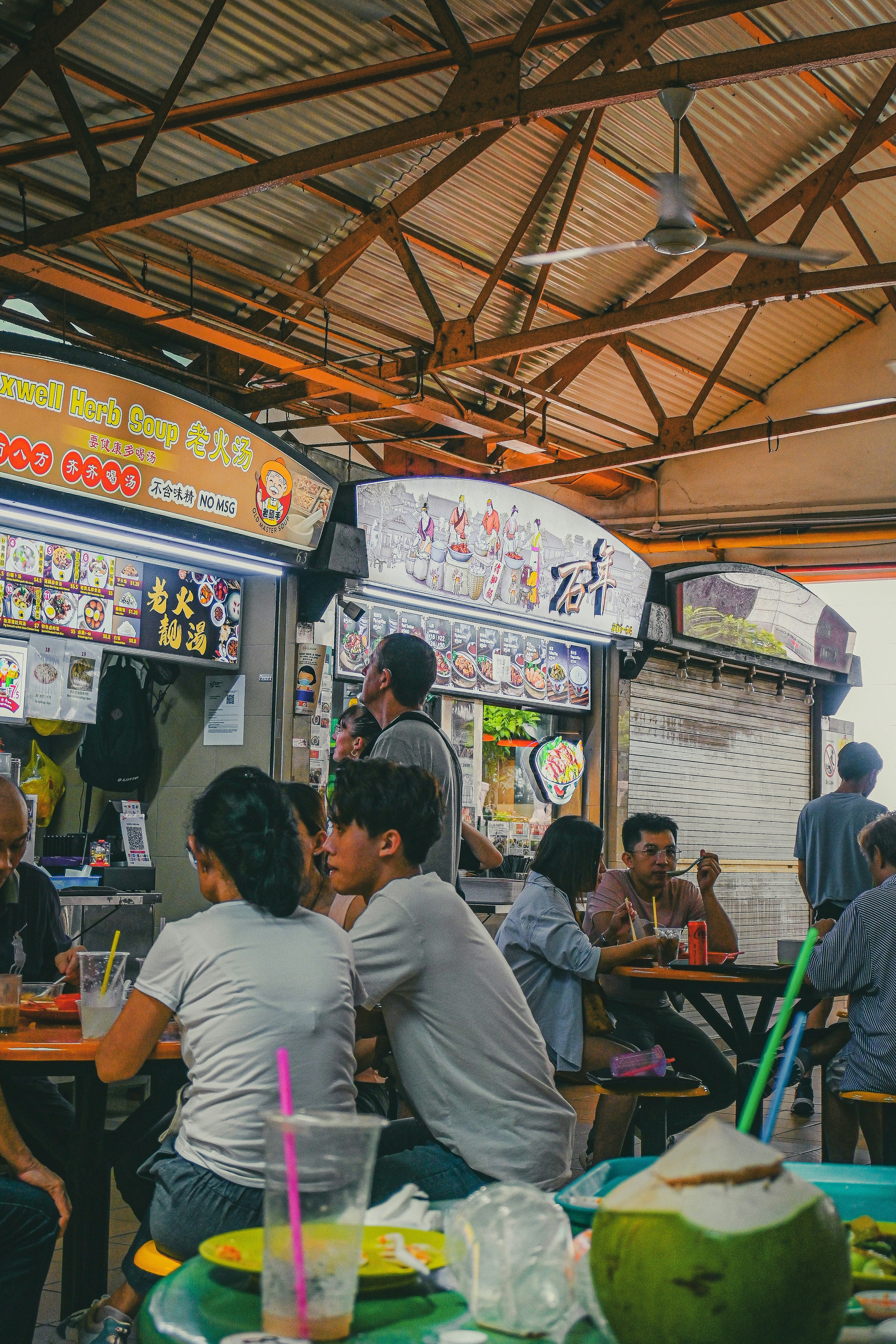 A group of people sitting at a table in a restaurant