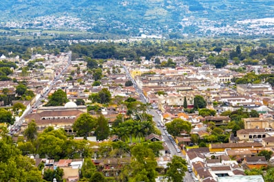An aerial view of a city with mountains in the background