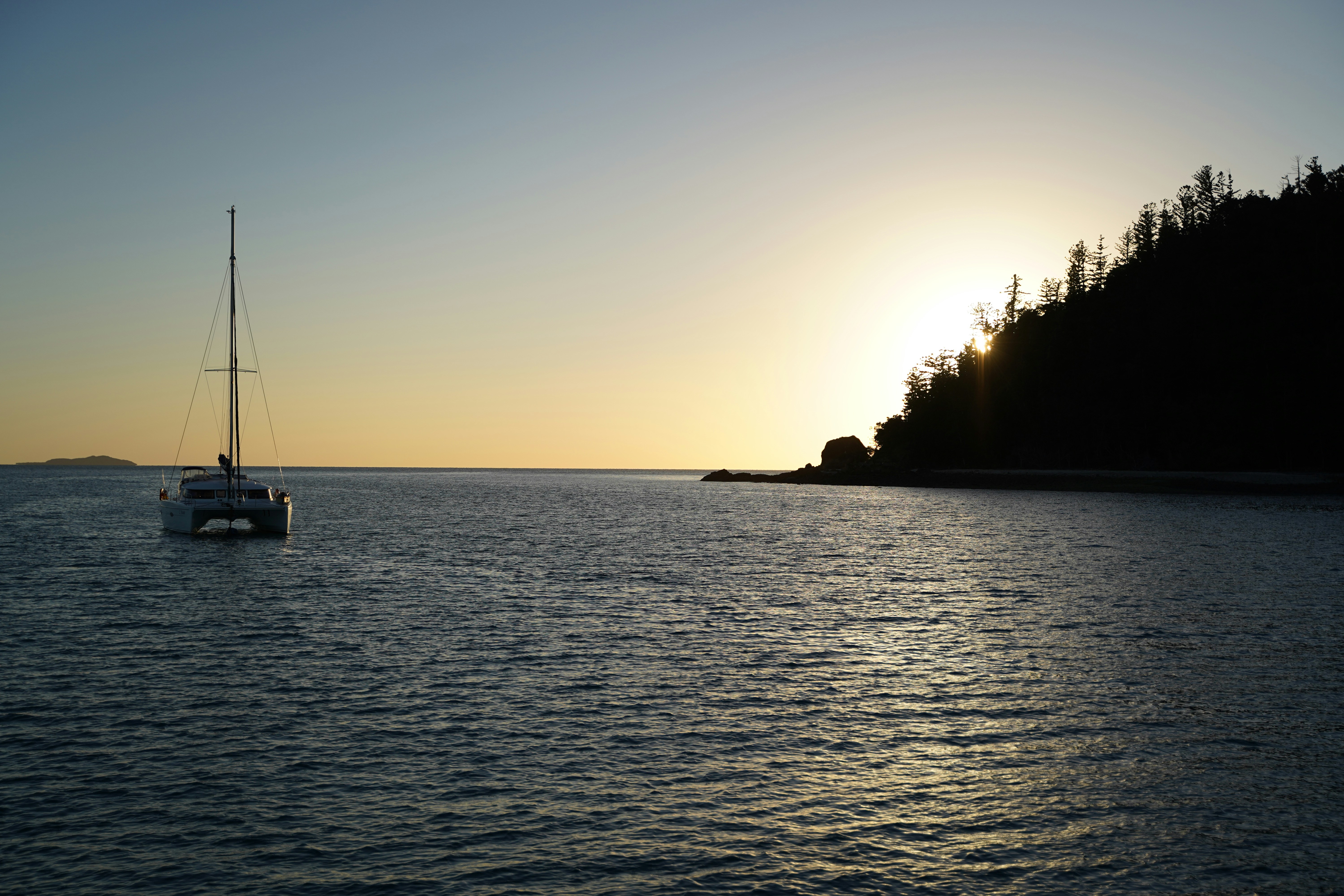 A sailboat is out on the water at sunset photo – Free Australia Image ...