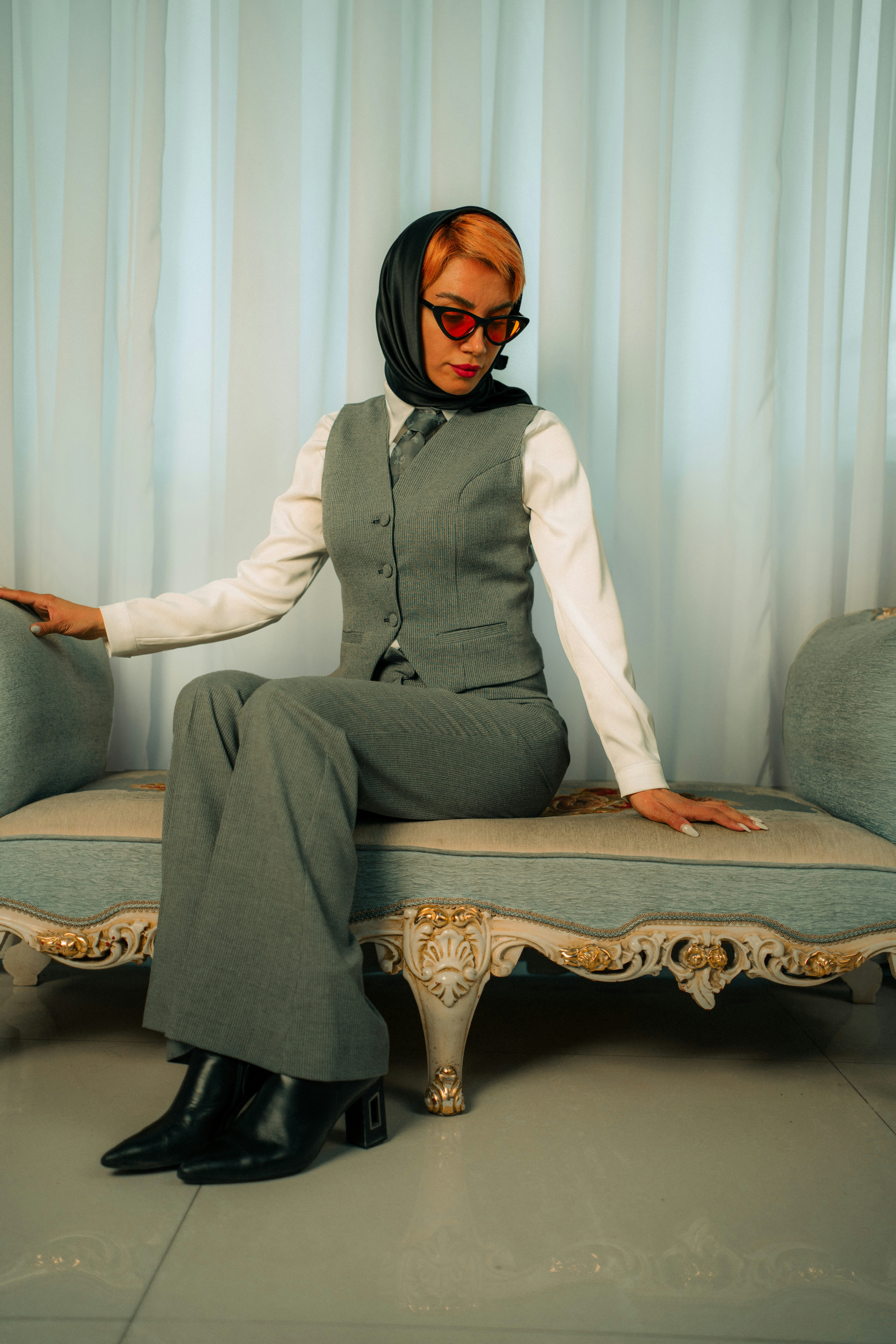 A woman sitting on a couch in a room