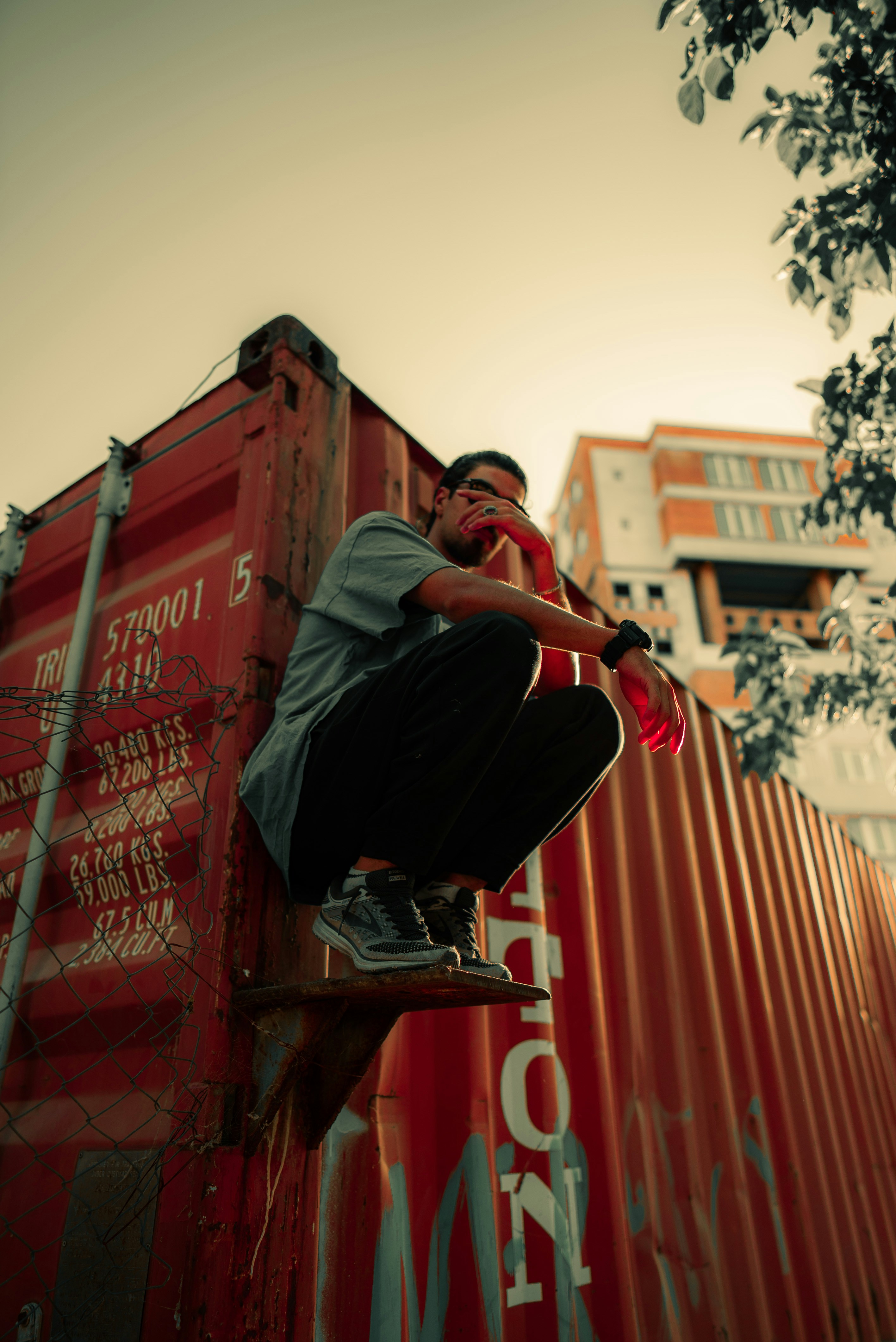 A man riding a skateboard on the side of a train