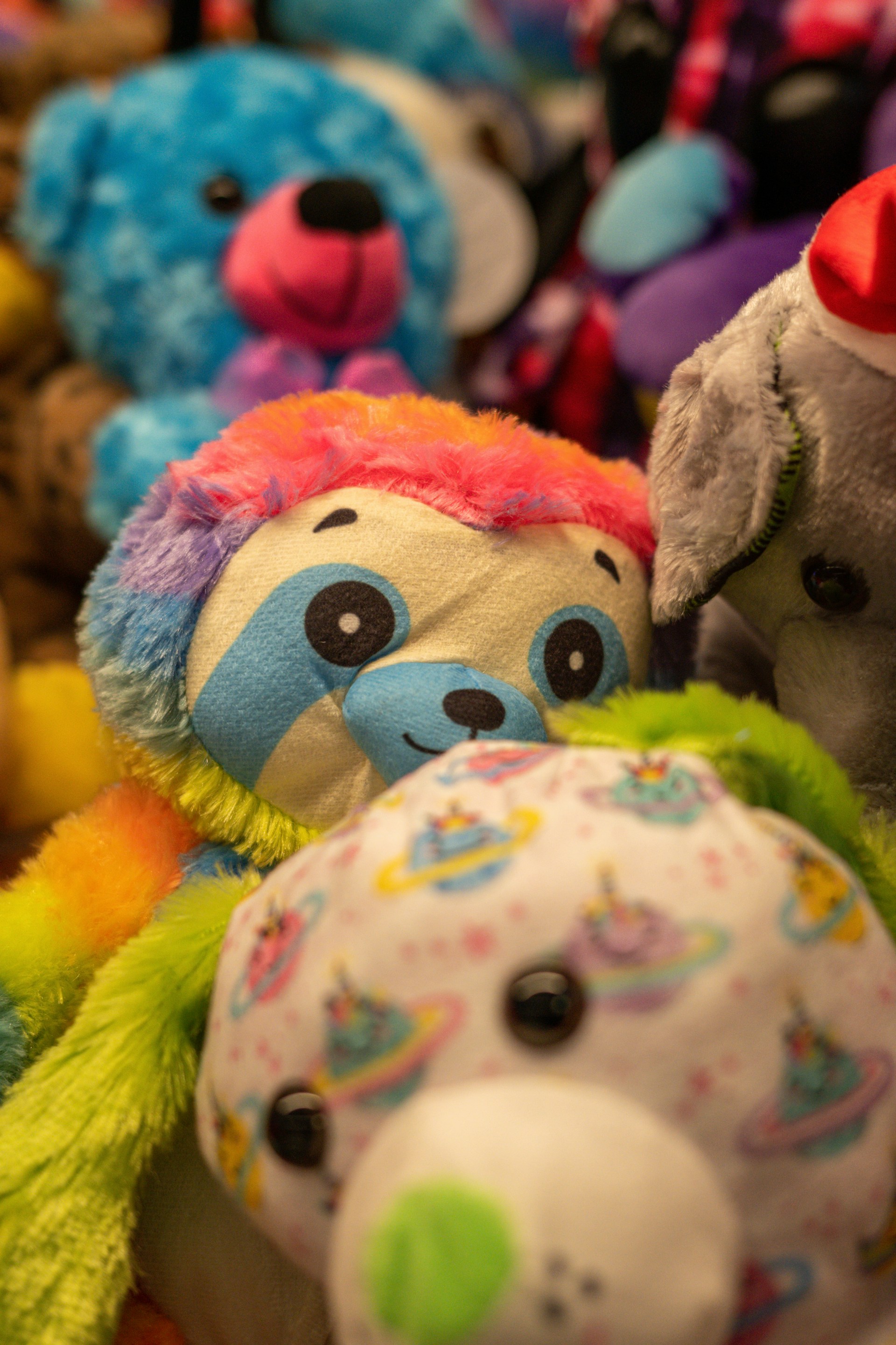 A group of stuffed animals sitting next to each other