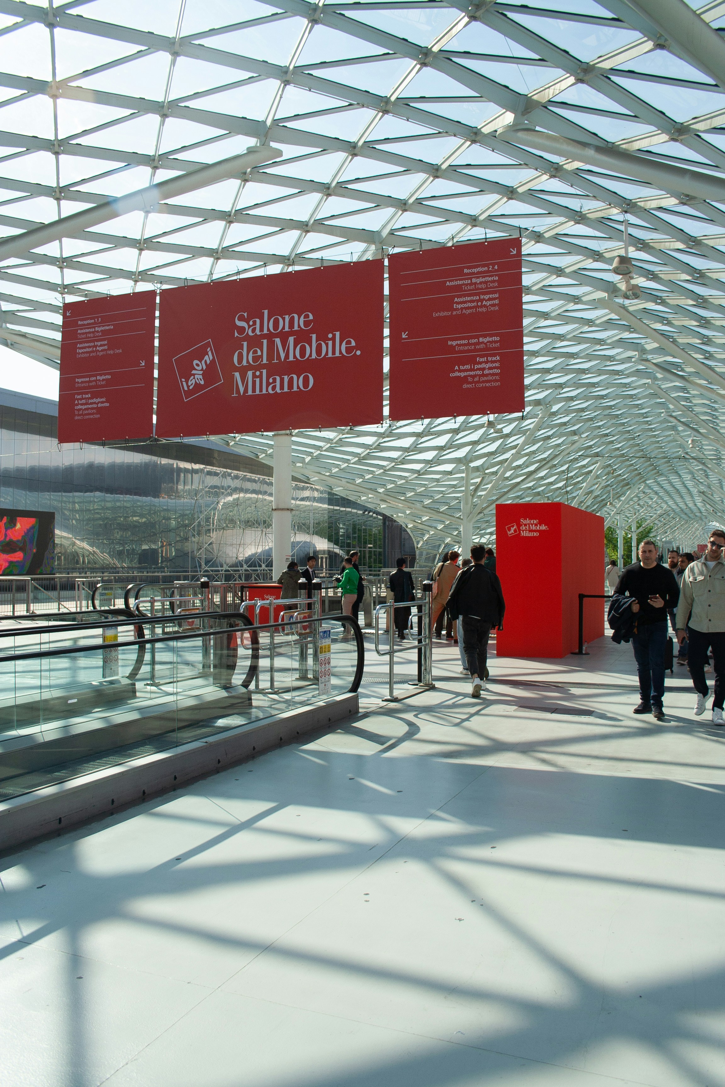 A group of people that are walking around a building