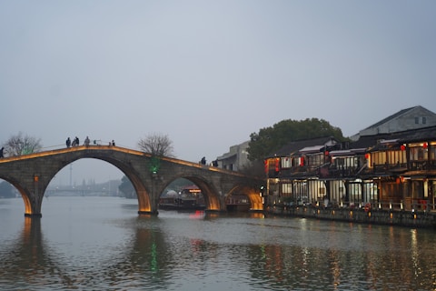 A bridge over a body of water with people on it