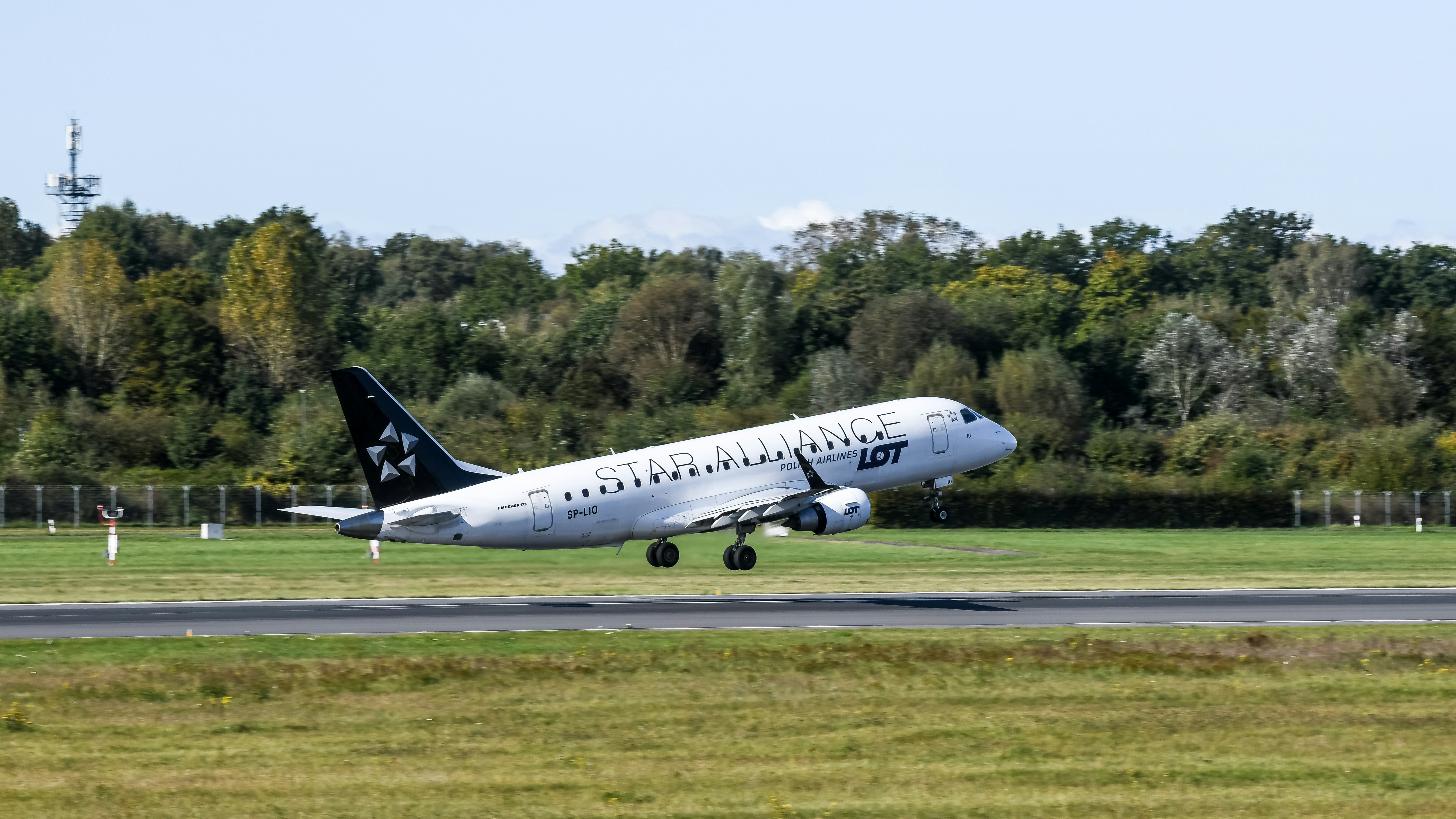 A large jetliner taking off from an airport runway