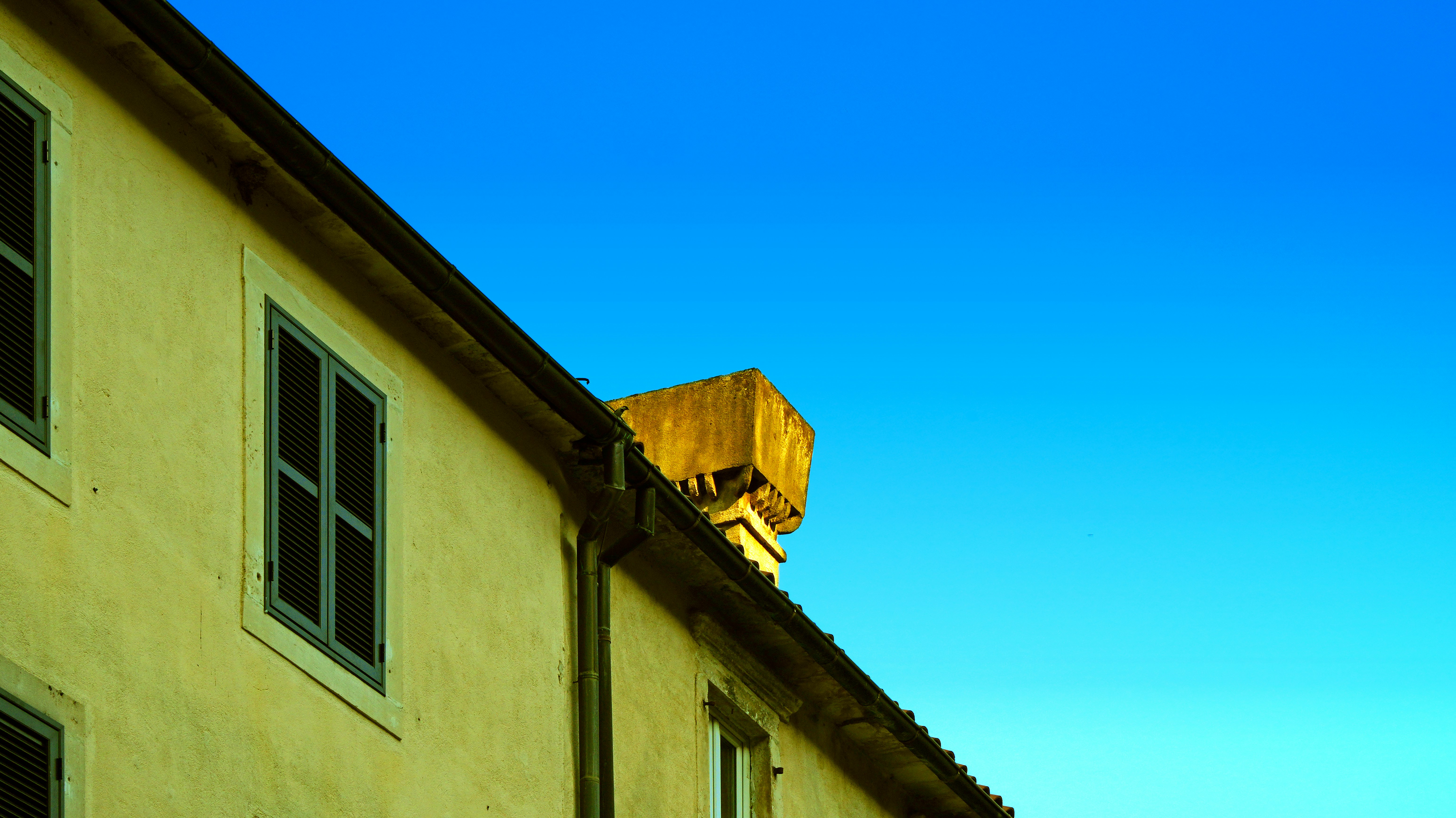 A building with a yellow sign on top of it