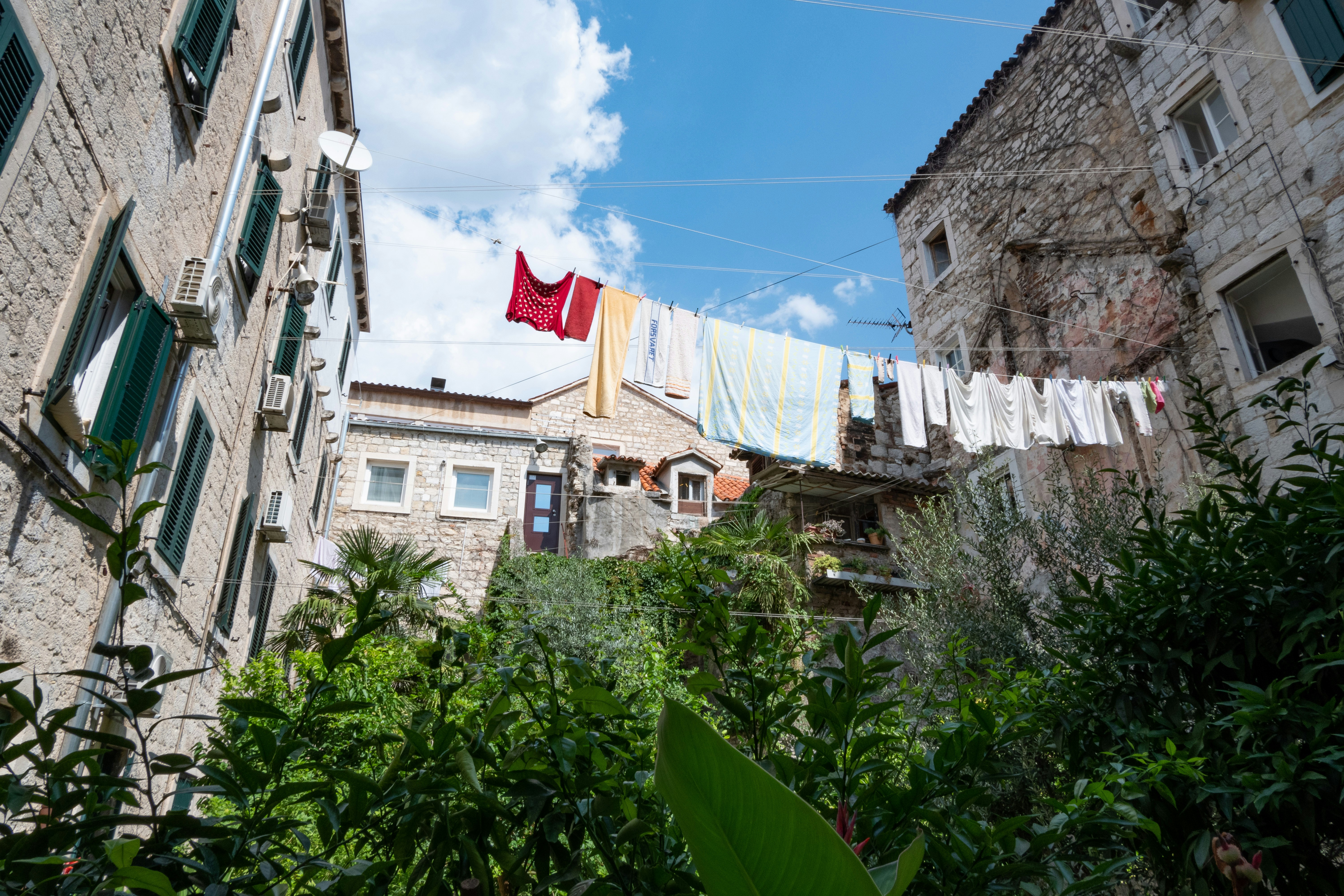 A row of buildings with clothes hanging on a line