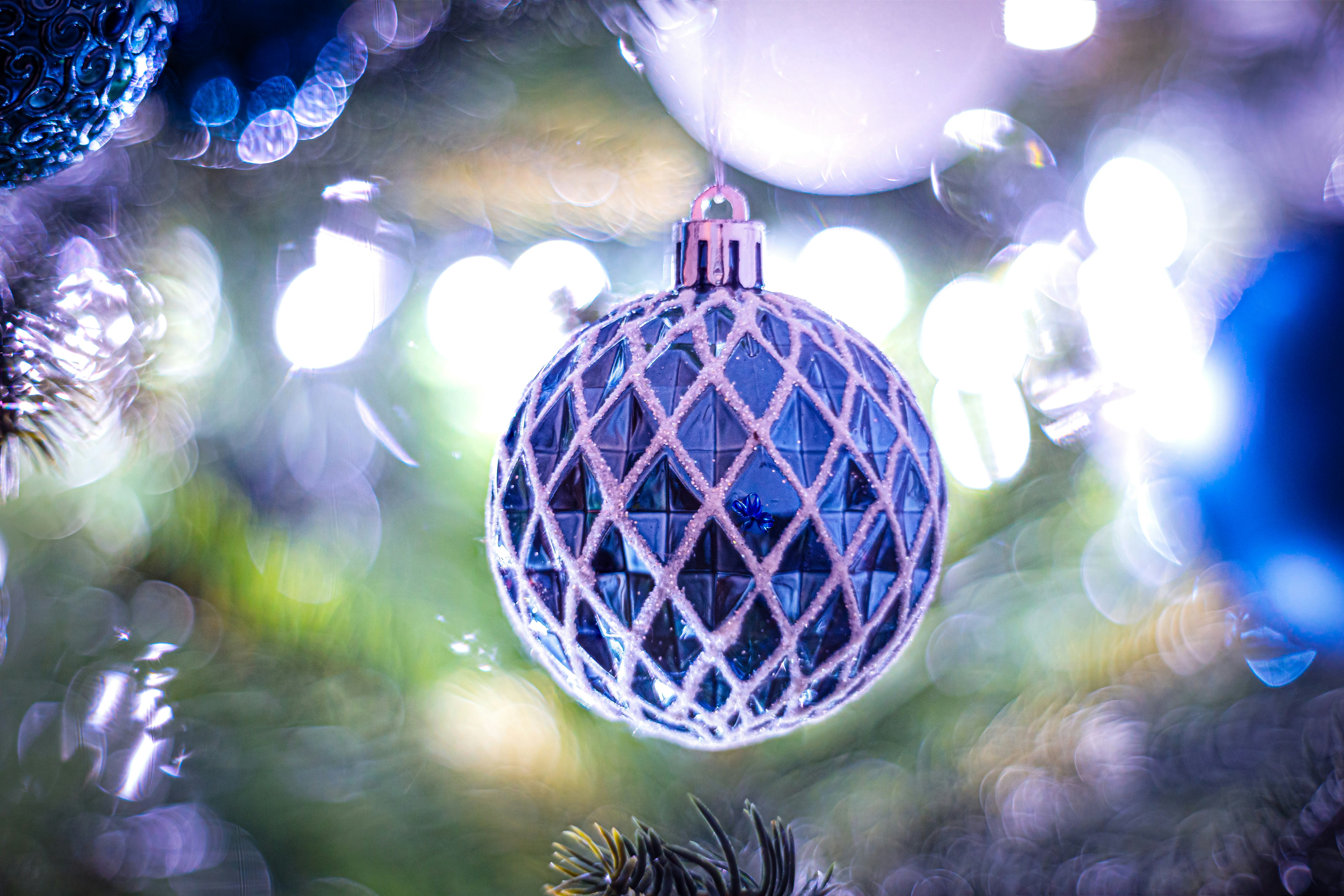 A christmas ornament hanging from a christmas tree