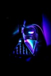 A darth vader helmet in the dark