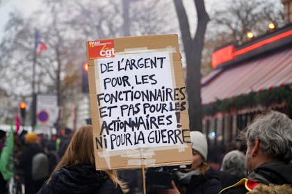 A group of people holding a protest sign
