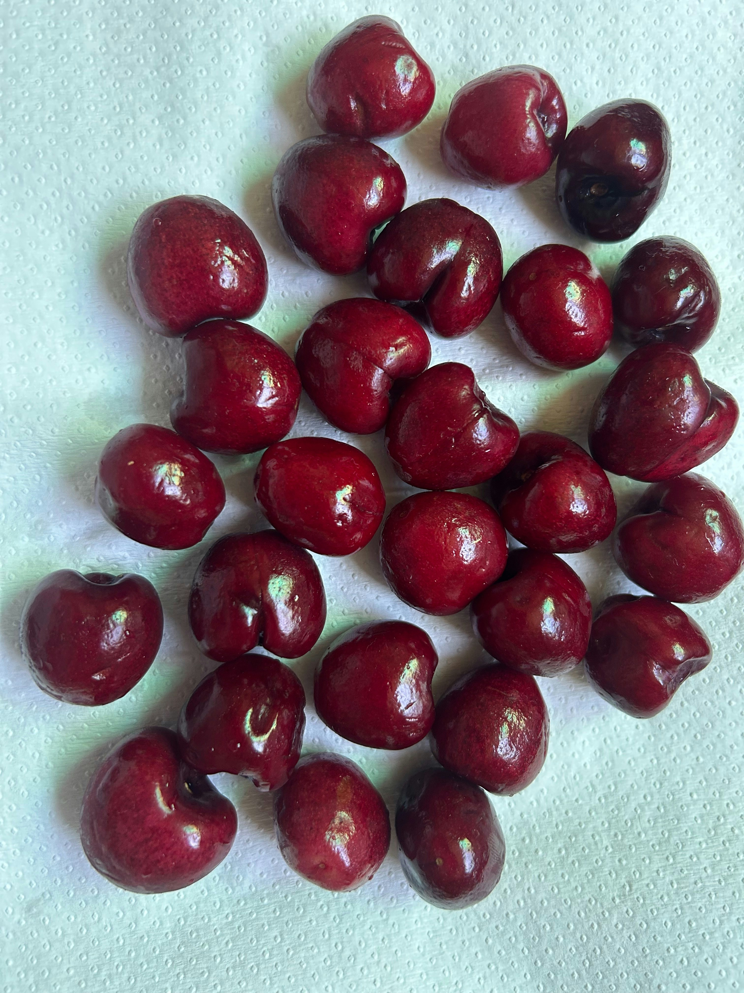 Golden red Rainier cherries on white background
