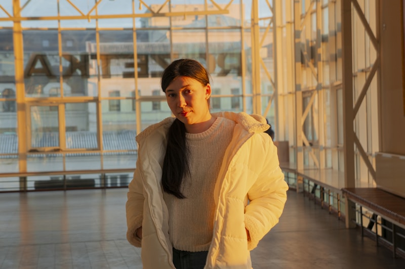 Sophisticated sugar baby in white coat