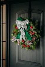A christmas wreath hanging on a door