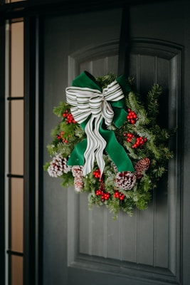 A christmas wreath hanging on a door