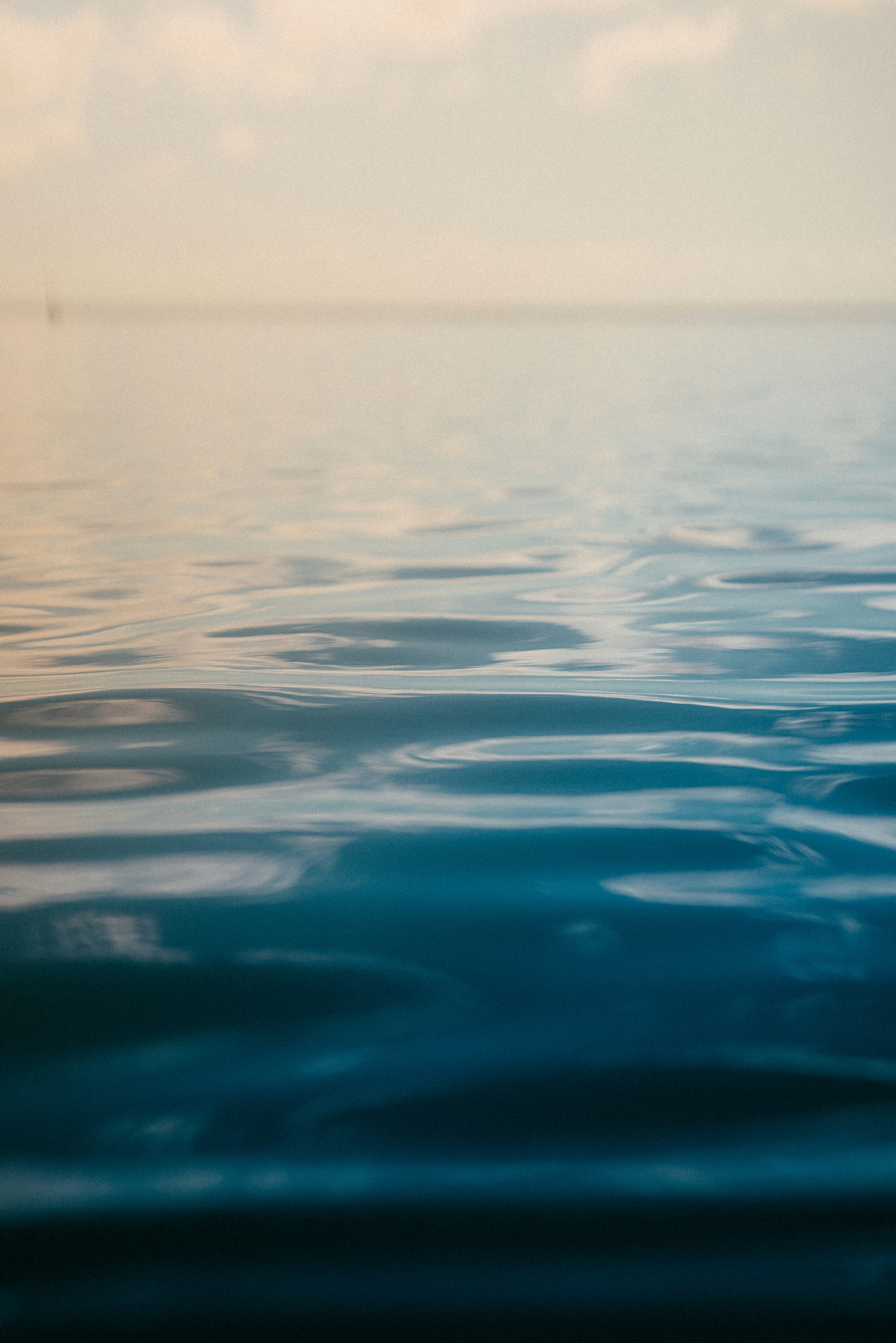 A body of water with a sky in the background