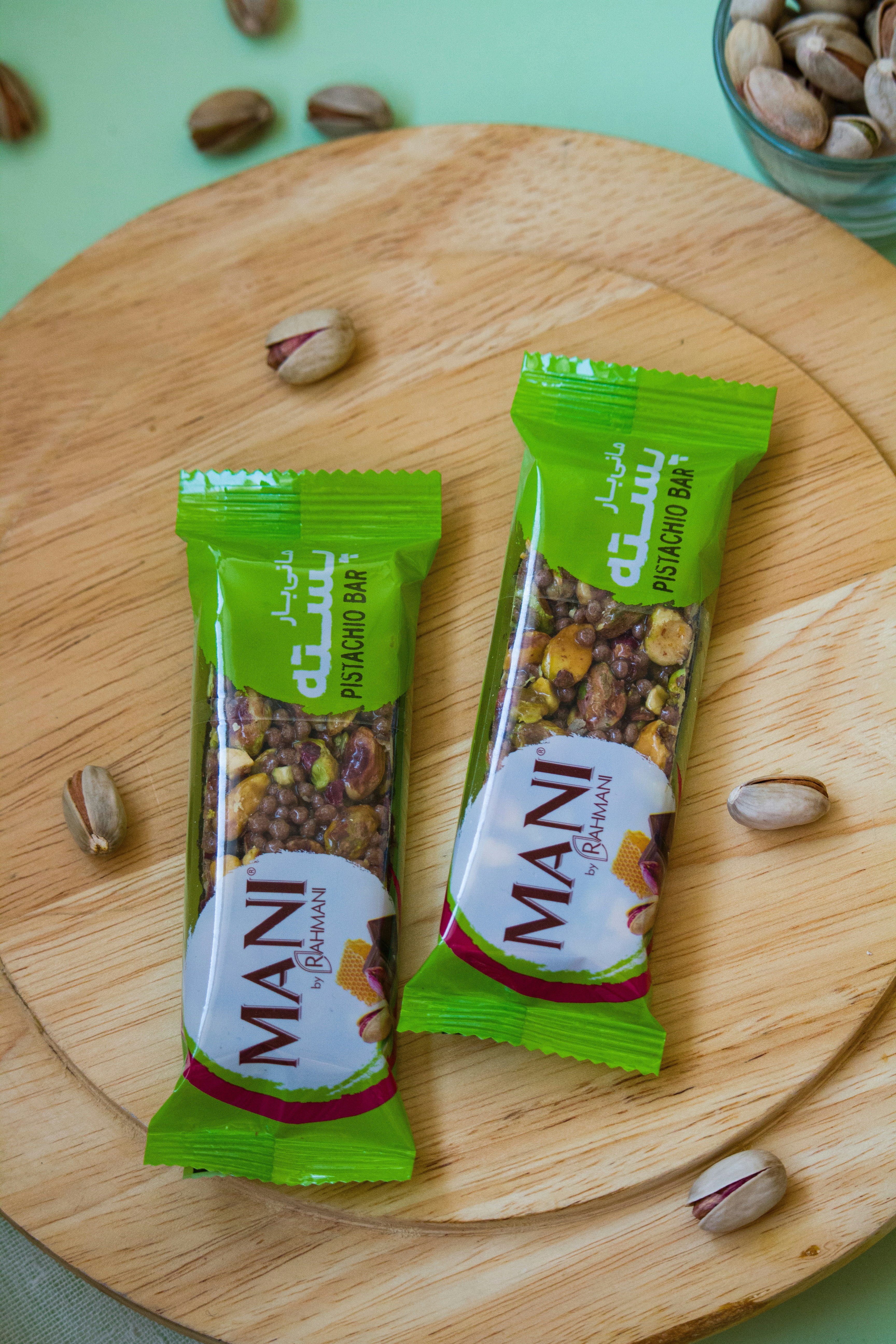 A couple of bags of nuts sitting on top of a cutting board