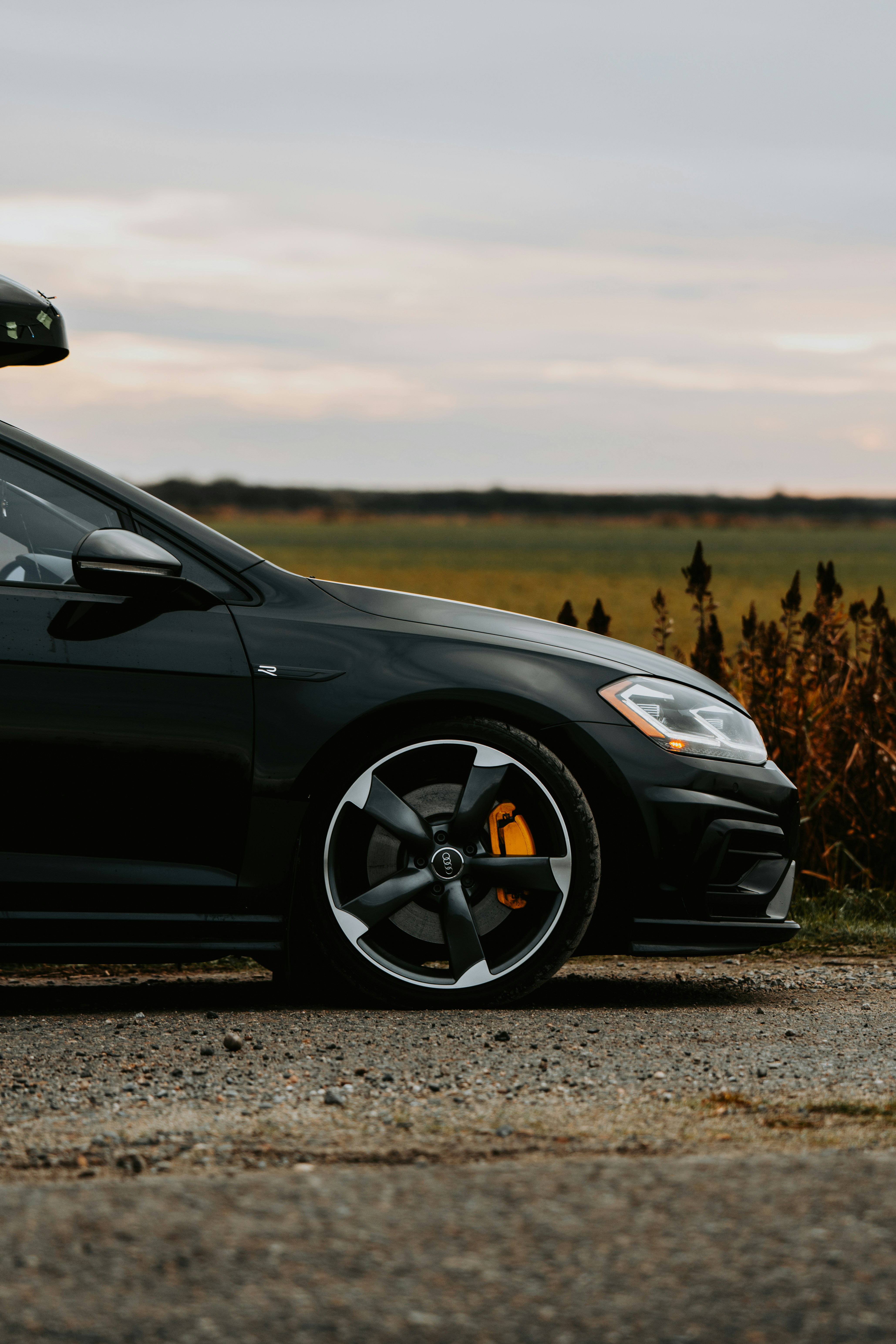A black car parked on the side of the road