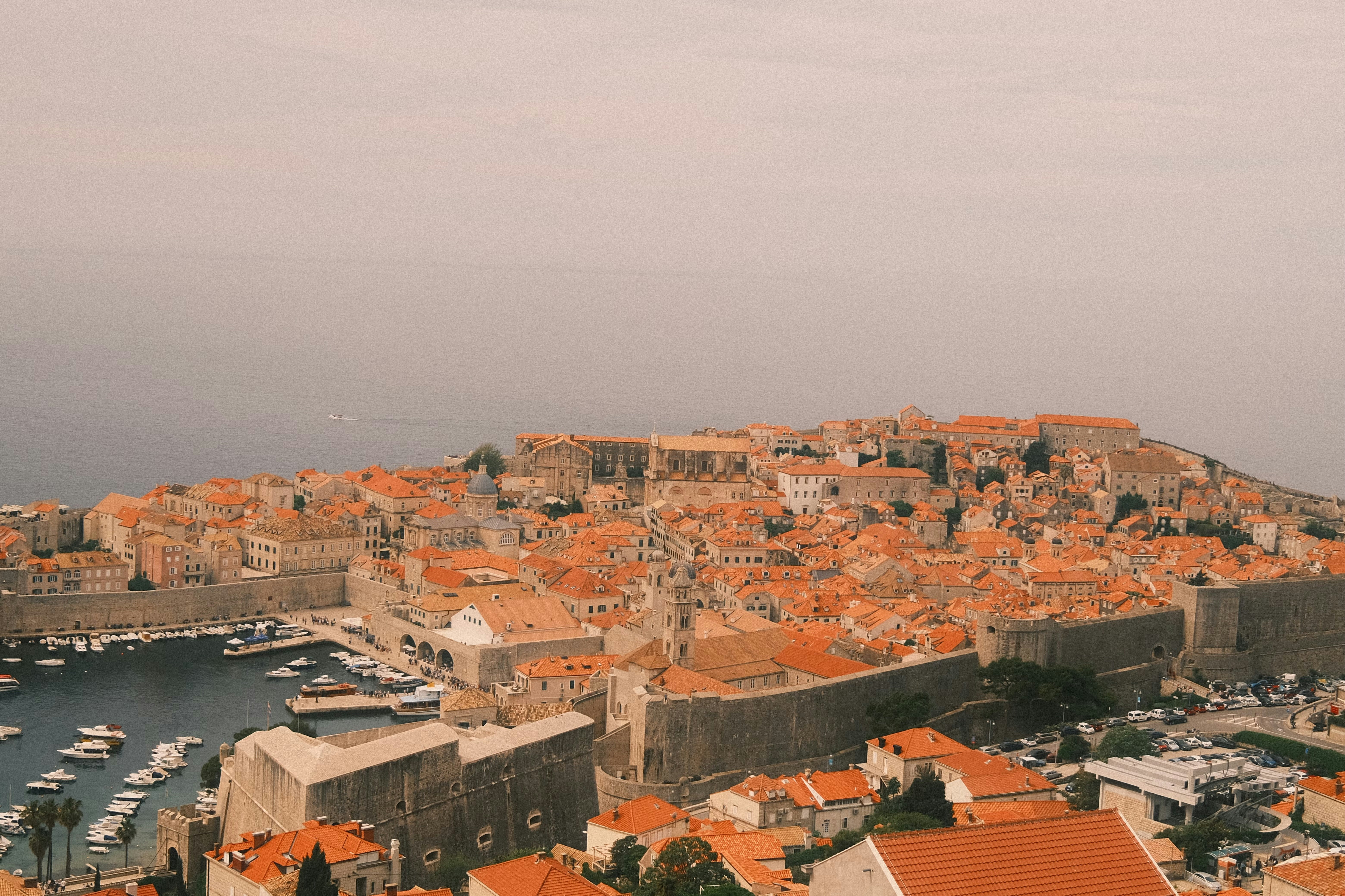 An aerial view of a city with red roofs