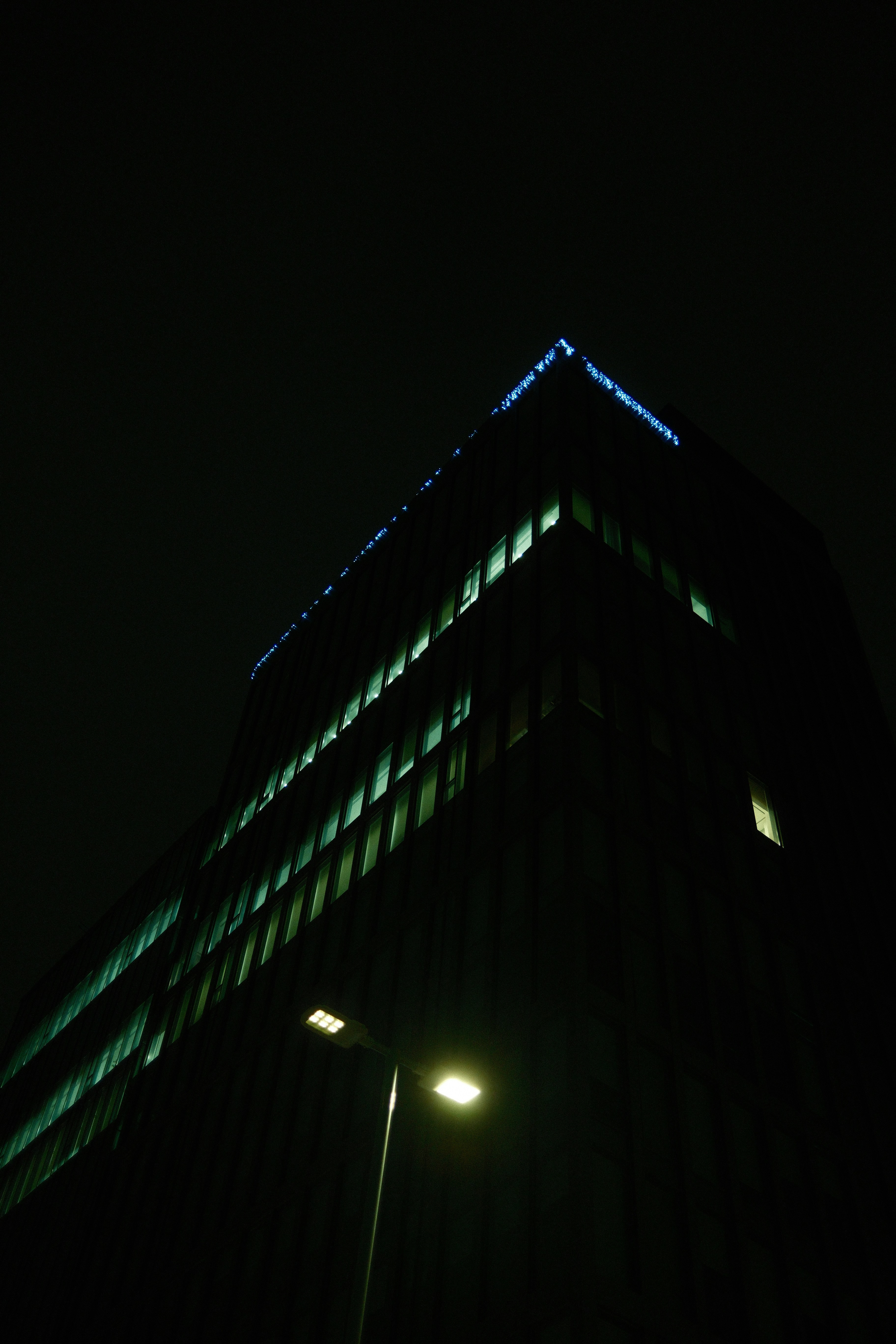 A very tall building lit up at night