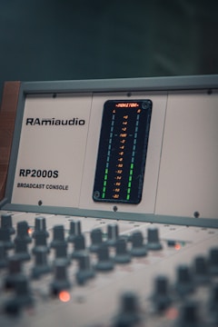 A close up of a sound mixing console