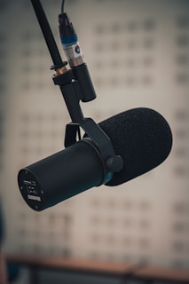A microphone in front of a computer screen