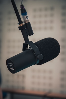 A microphone in front of a computer screen
