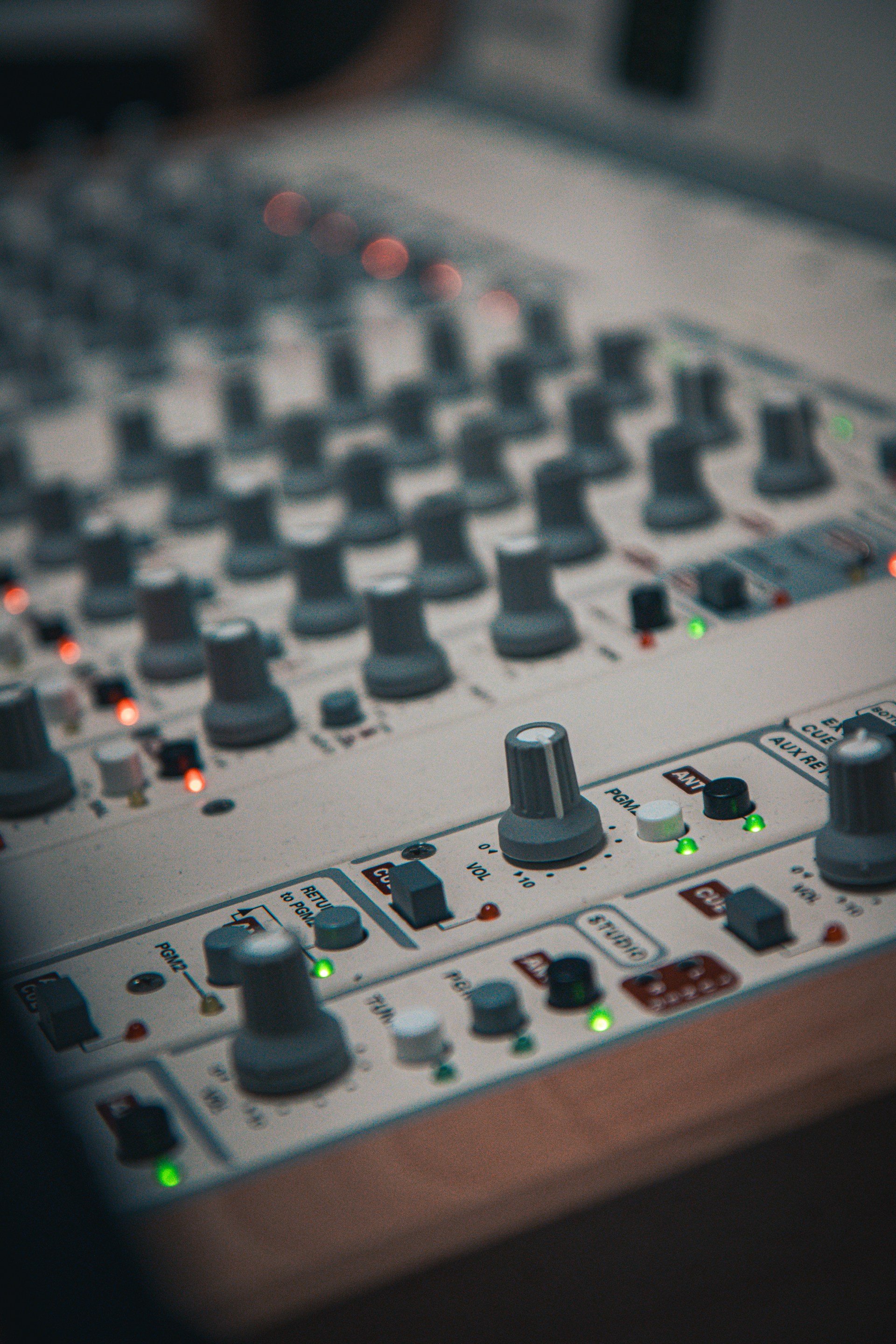 A close up of a sound mixing console