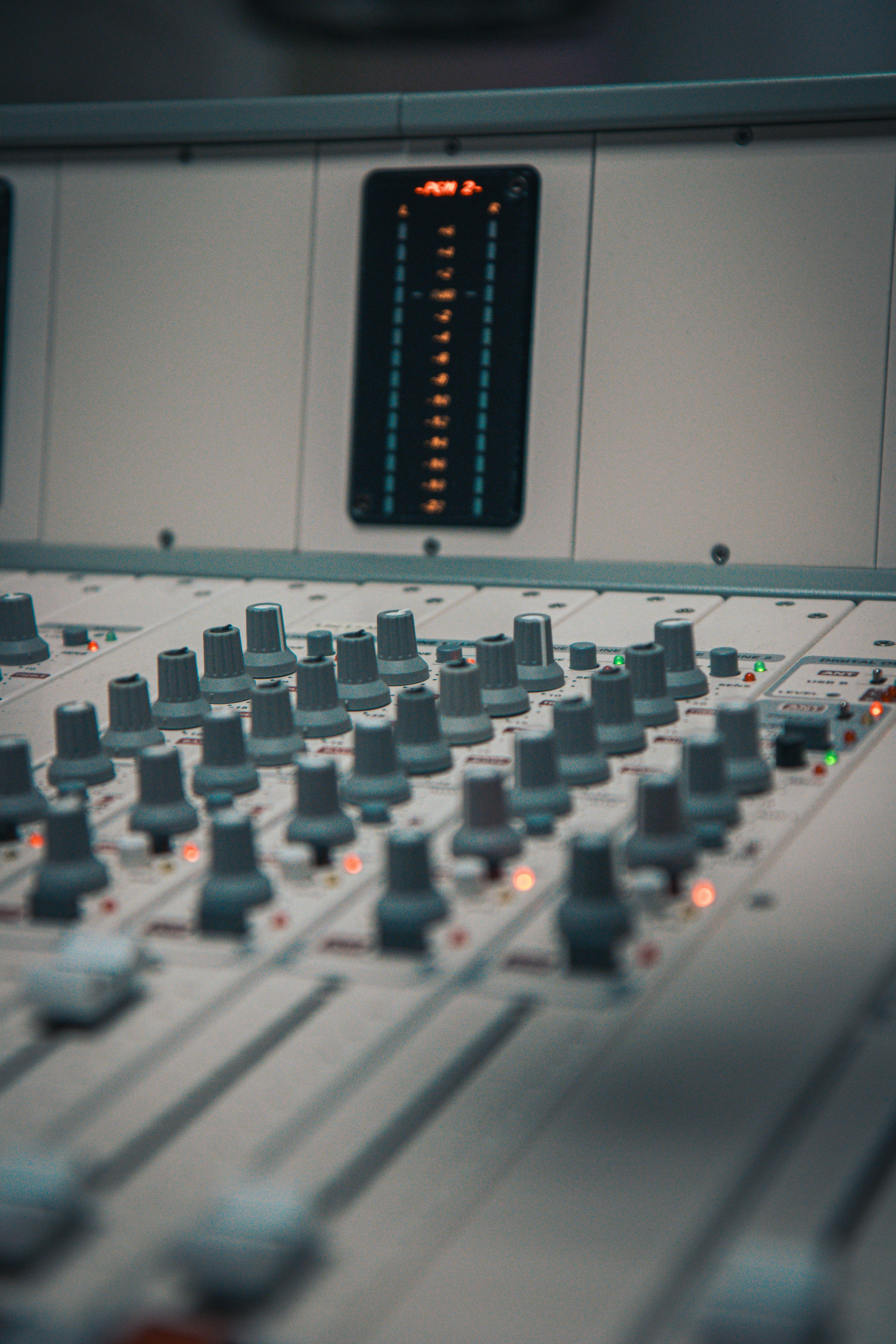 A close up of a sound mixing console