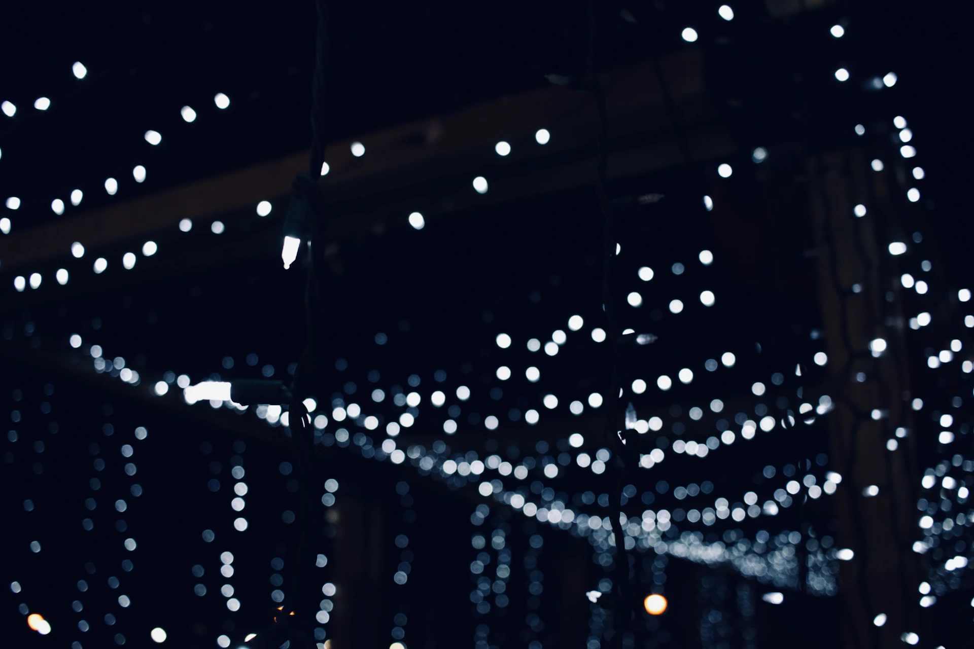 A string of lights hanging from a ceiling