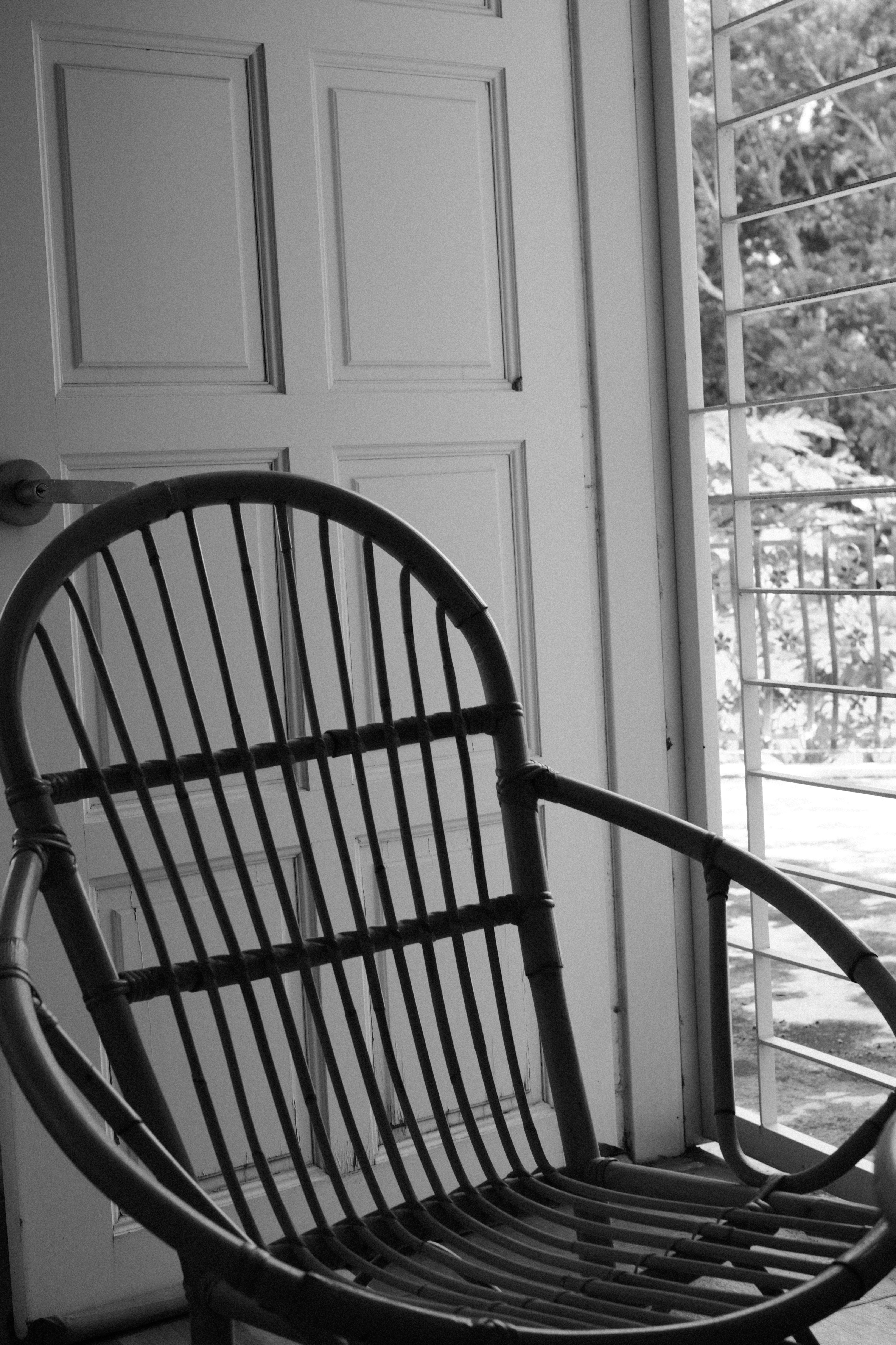 A black and white photo of a rocking chair