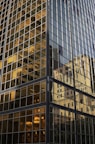 The reflection of a building in the windows of another building
