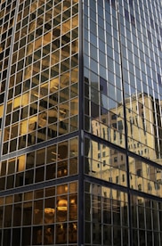 The reflection of a building in the windows of another building