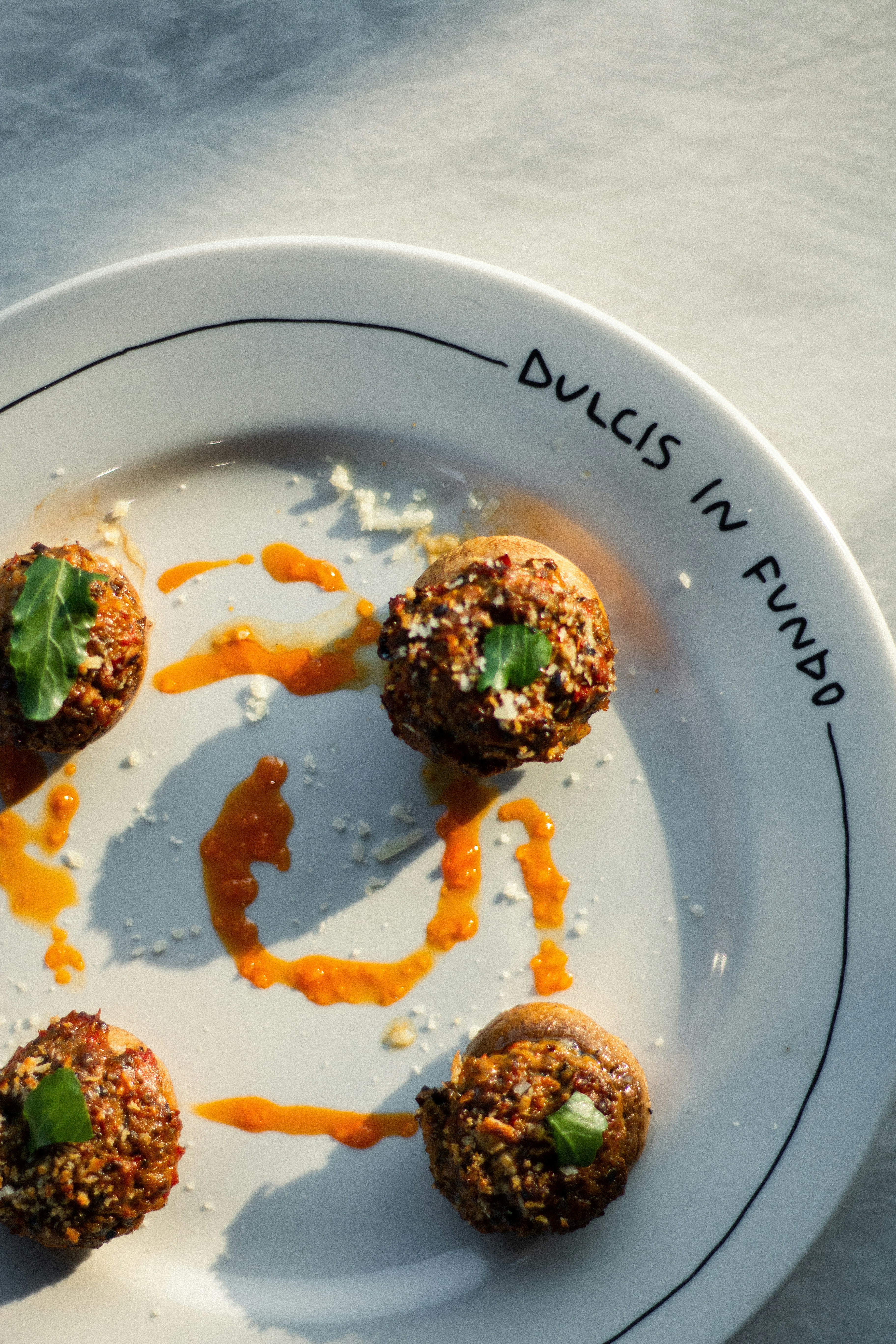 A white plate topped with meatballs covered in sauce photo – Free Food ...