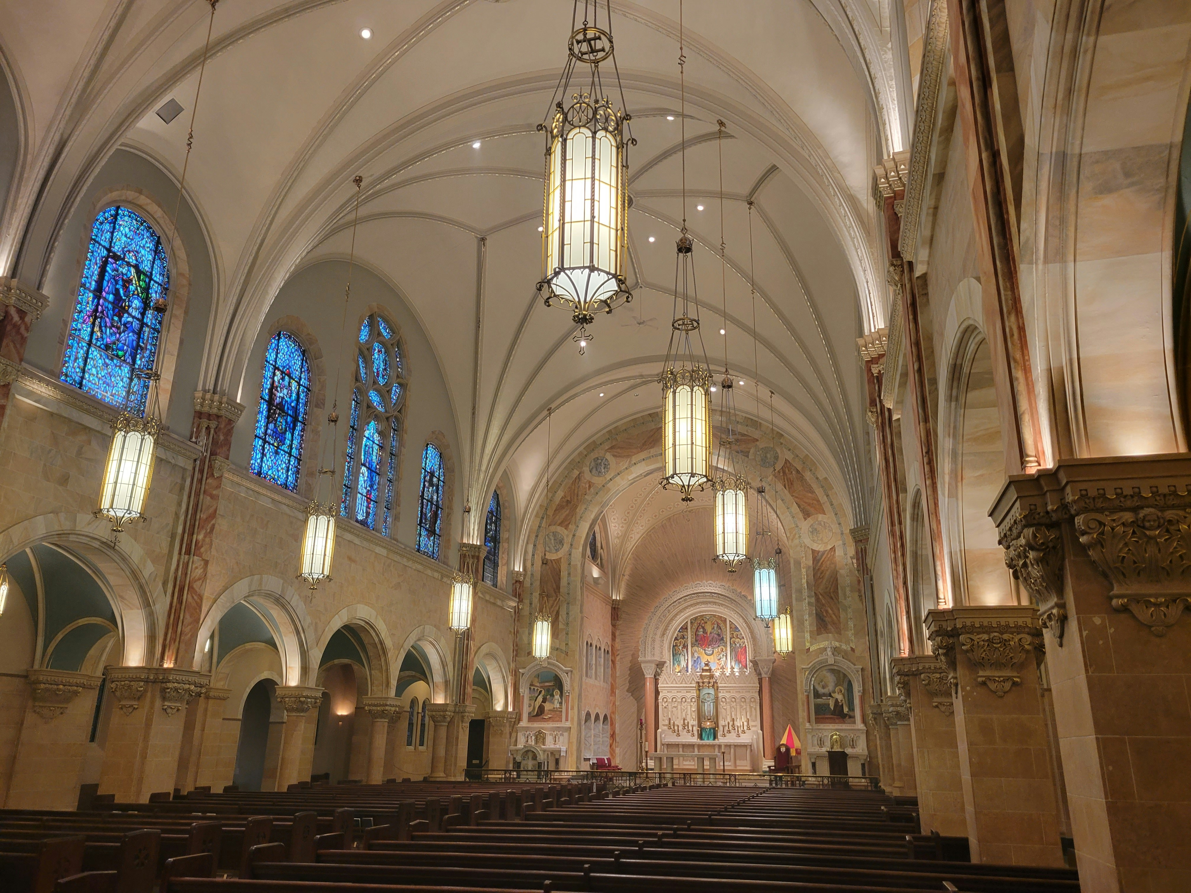 A large cathedral with high vaulted ceilings and stained glass windows
