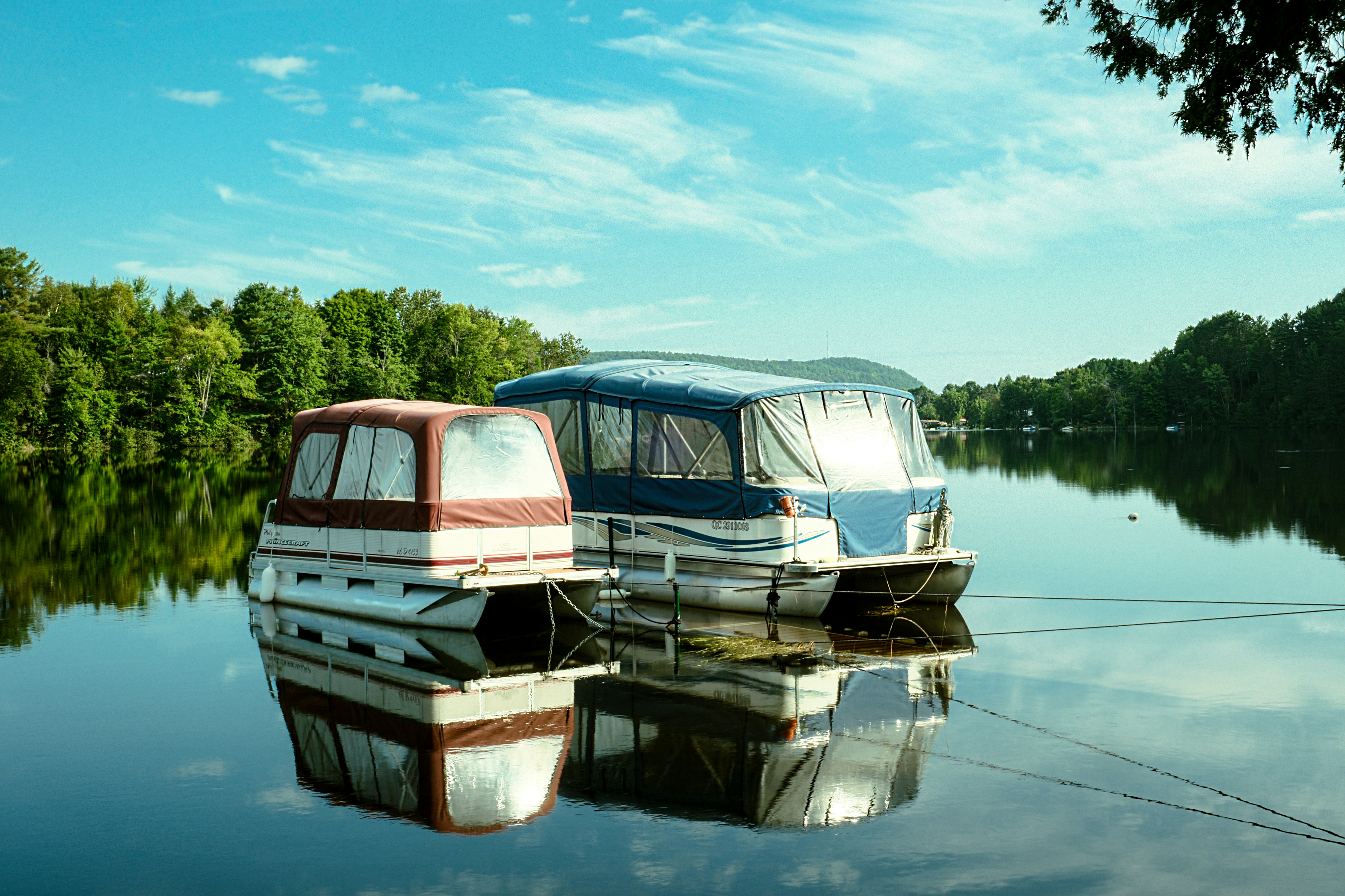 A couple of boats that are sitting in the water