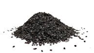 A pile of black coal on a white background