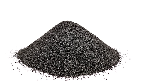 A pile of black sand on a white background