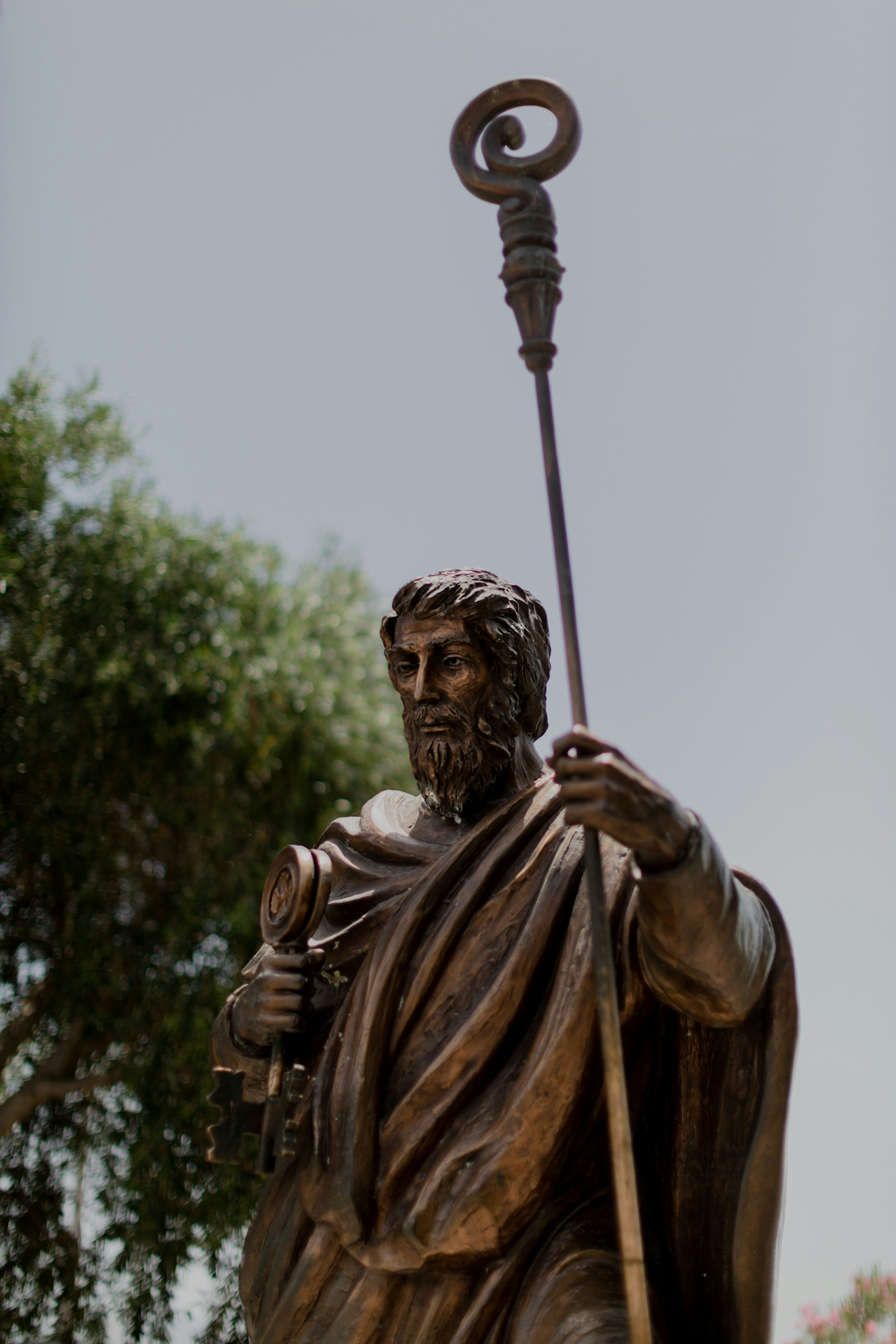 A statue of a man holding a staff
