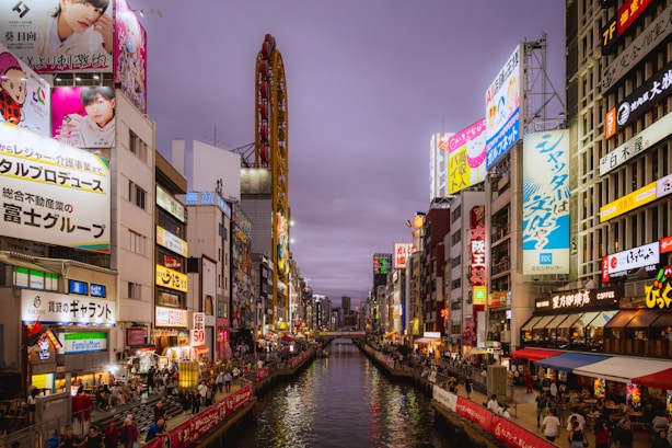 A river running through a city next to tall buildings