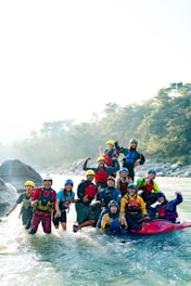 A group of people on a raft in a river