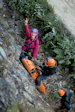 A woman is climbing up a steep hill