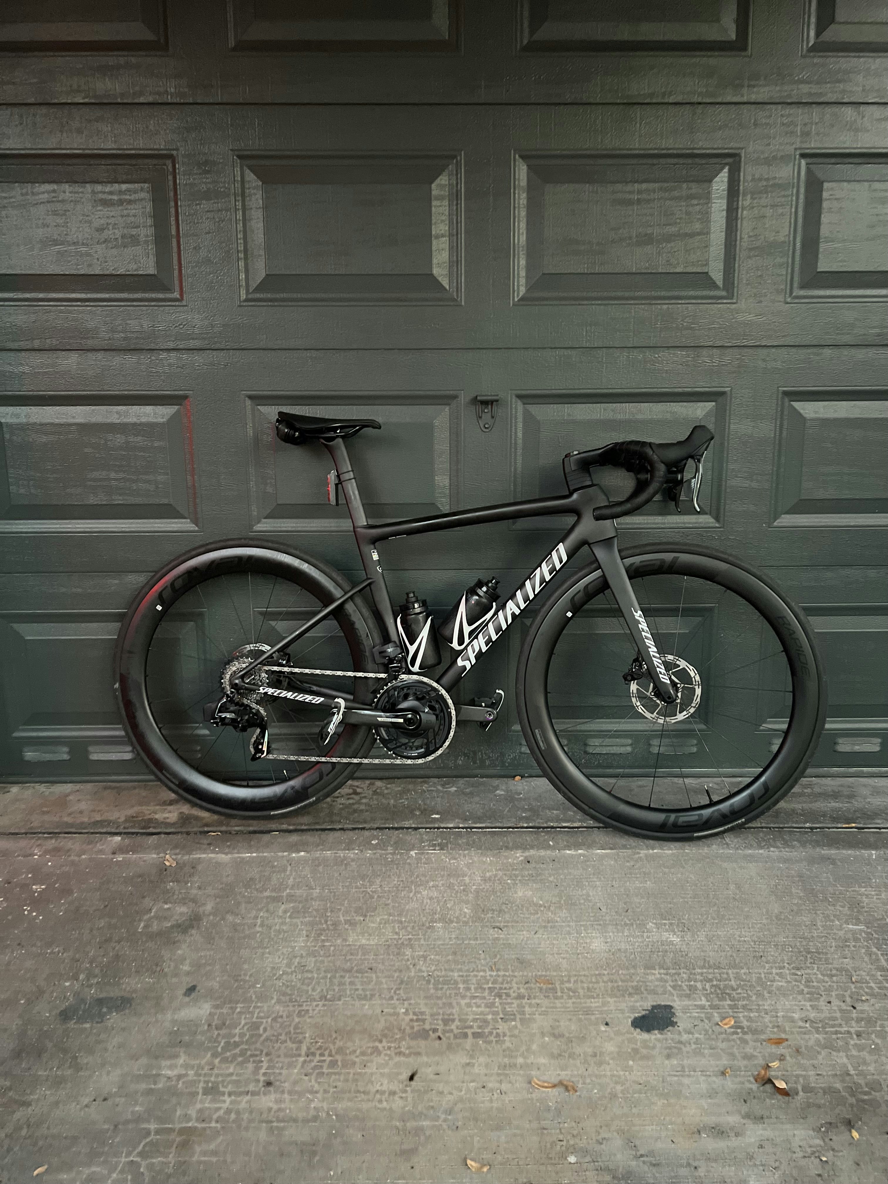 A bike parked in front of a garage door