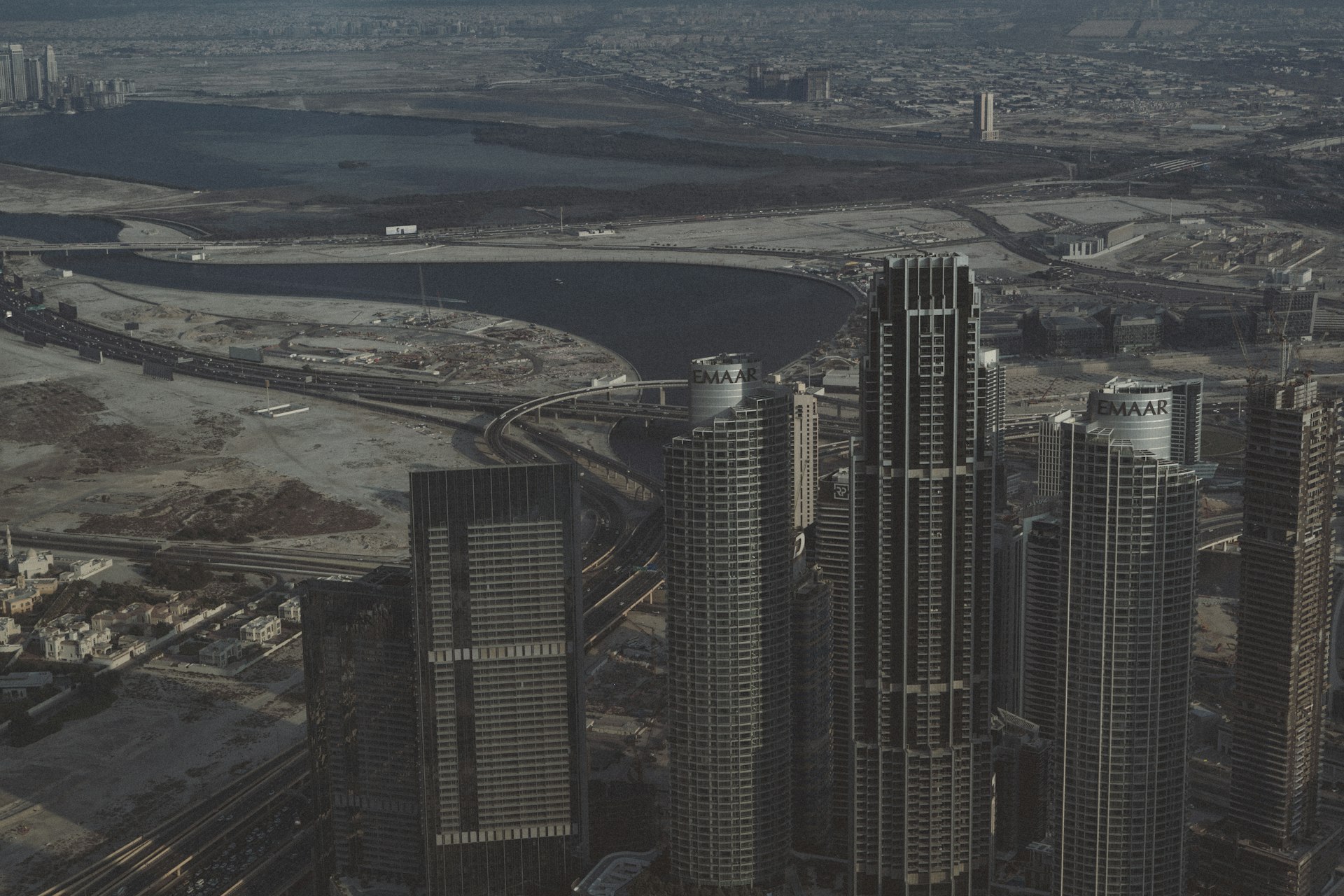 An aerial view of a city with tall buildings