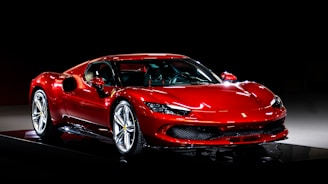 A red sports car on a black background