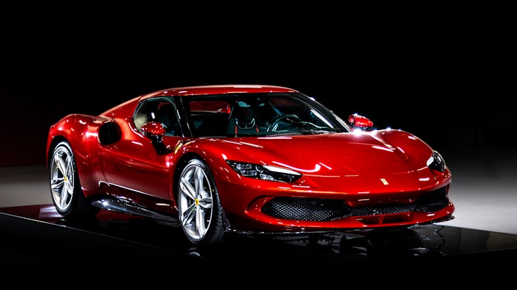A red sports car on a black background